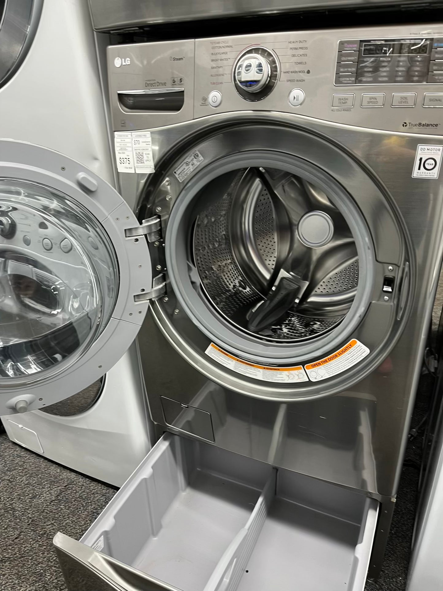 ^ ITEM #W94F LG front load washer large capacity 27” with pedestal