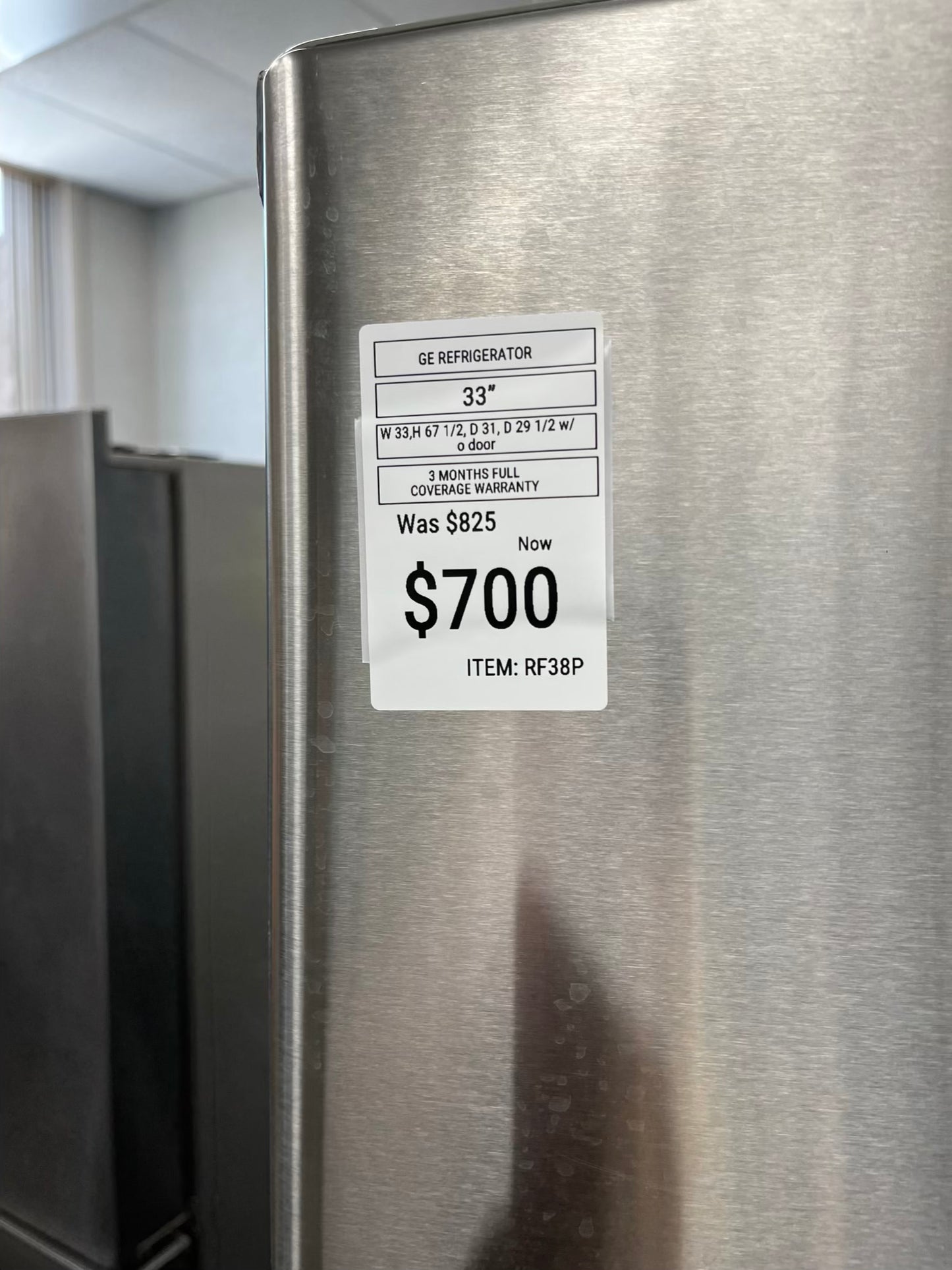 ^ Item #RF38P GE french door refrigerator stainless steel w/ ice dispenser inside 33” in