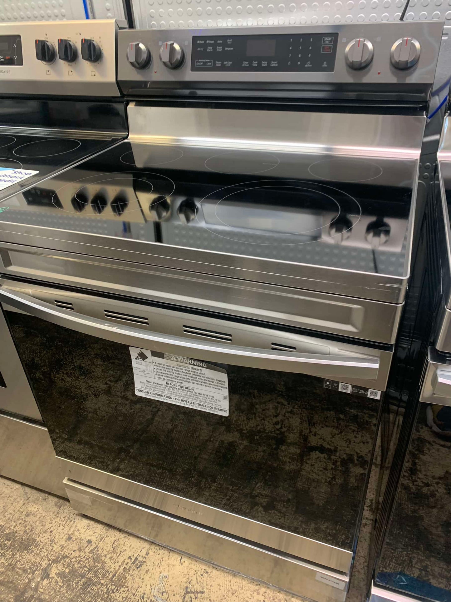 - ★ Samsung Open Box 6.3 cu. ft. Smart Wi-Fi Enabled Convection Electric Range with No Preheat AirFry in Black Stainless Steel - ER467