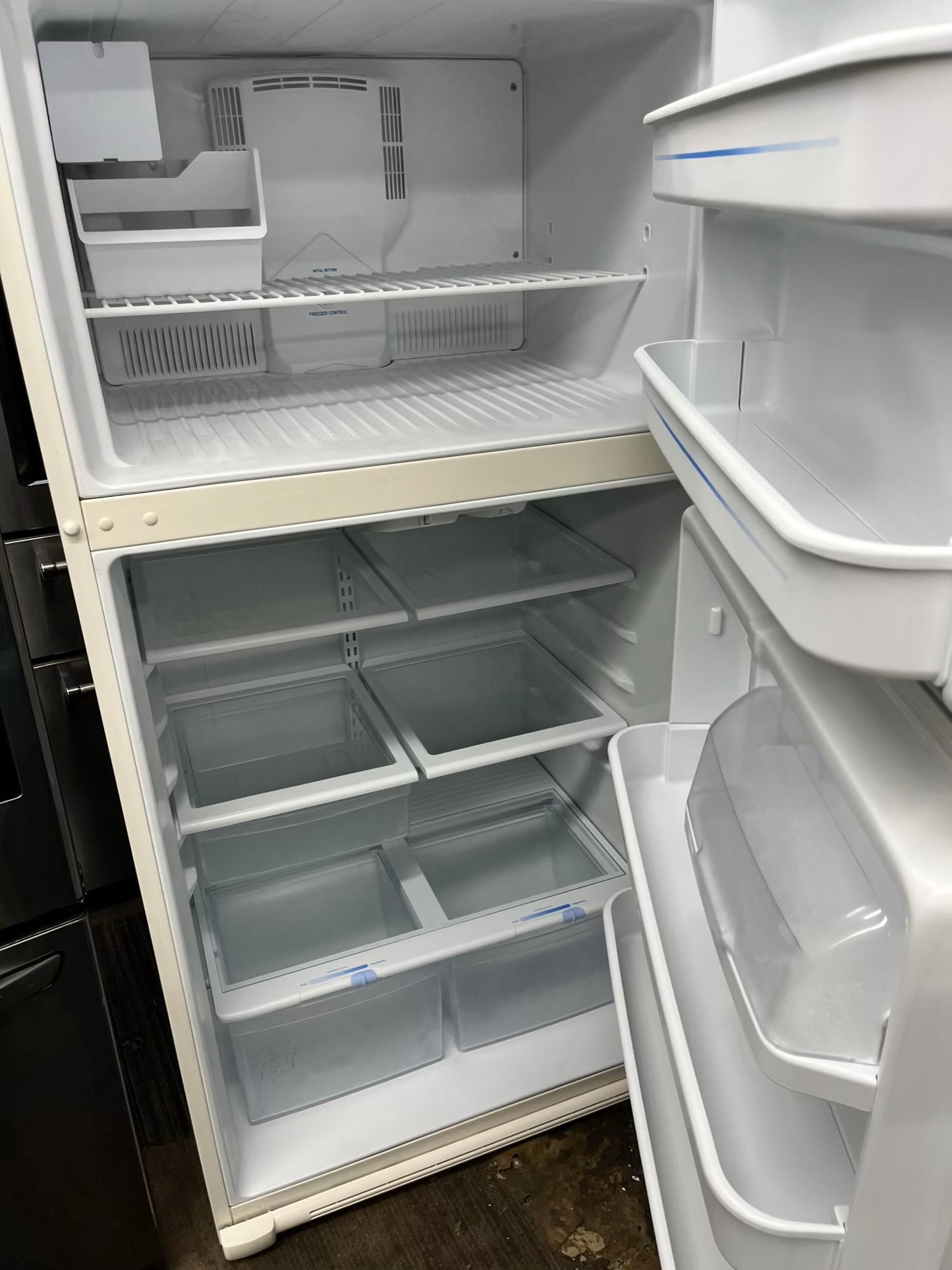 ^ ITEM: #RF28F GE top freezer bisque refrigerator 33” in