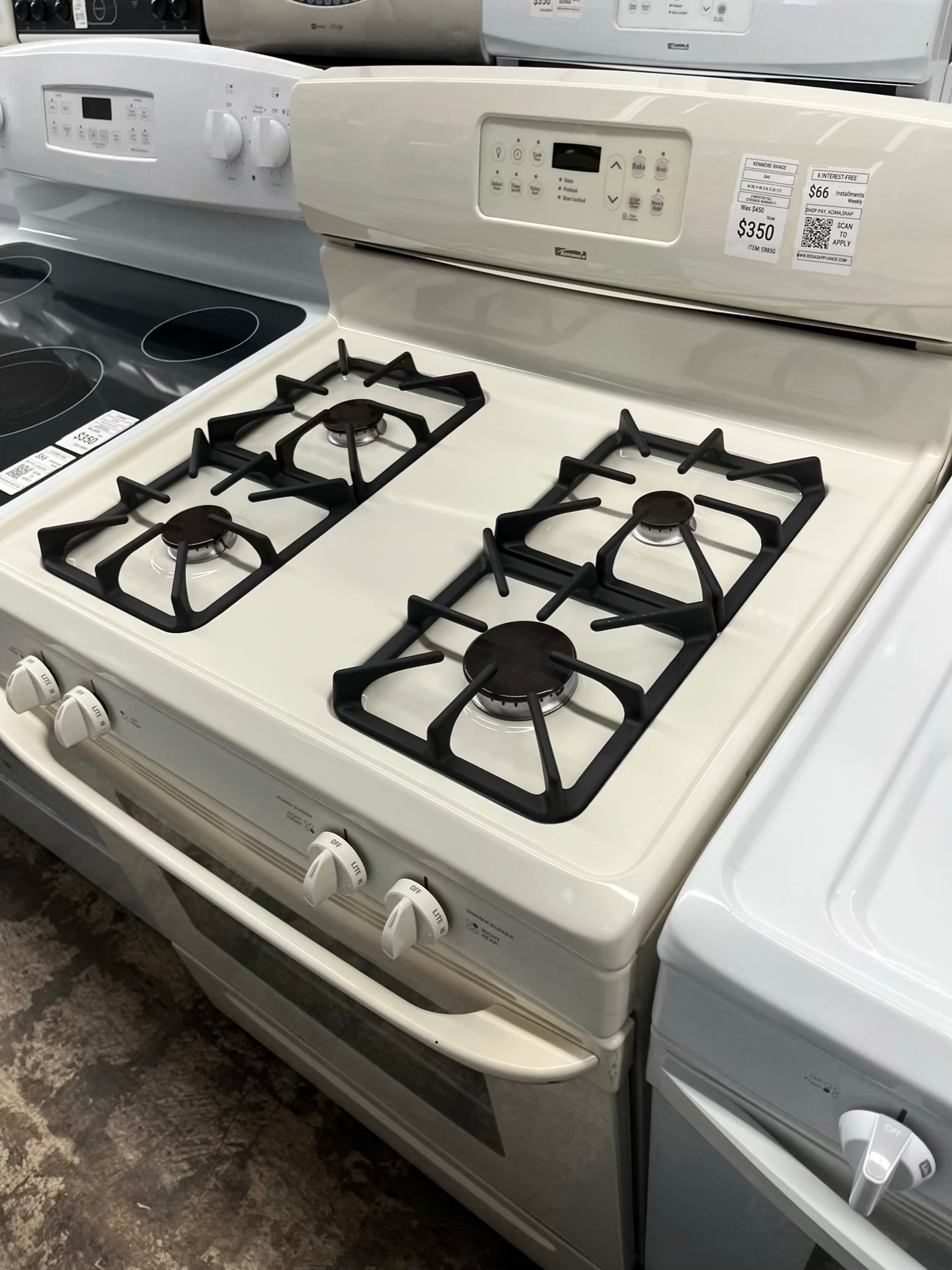 ^ ITEM #ER85G Kenmore gas range bisque 4 burner 24” in