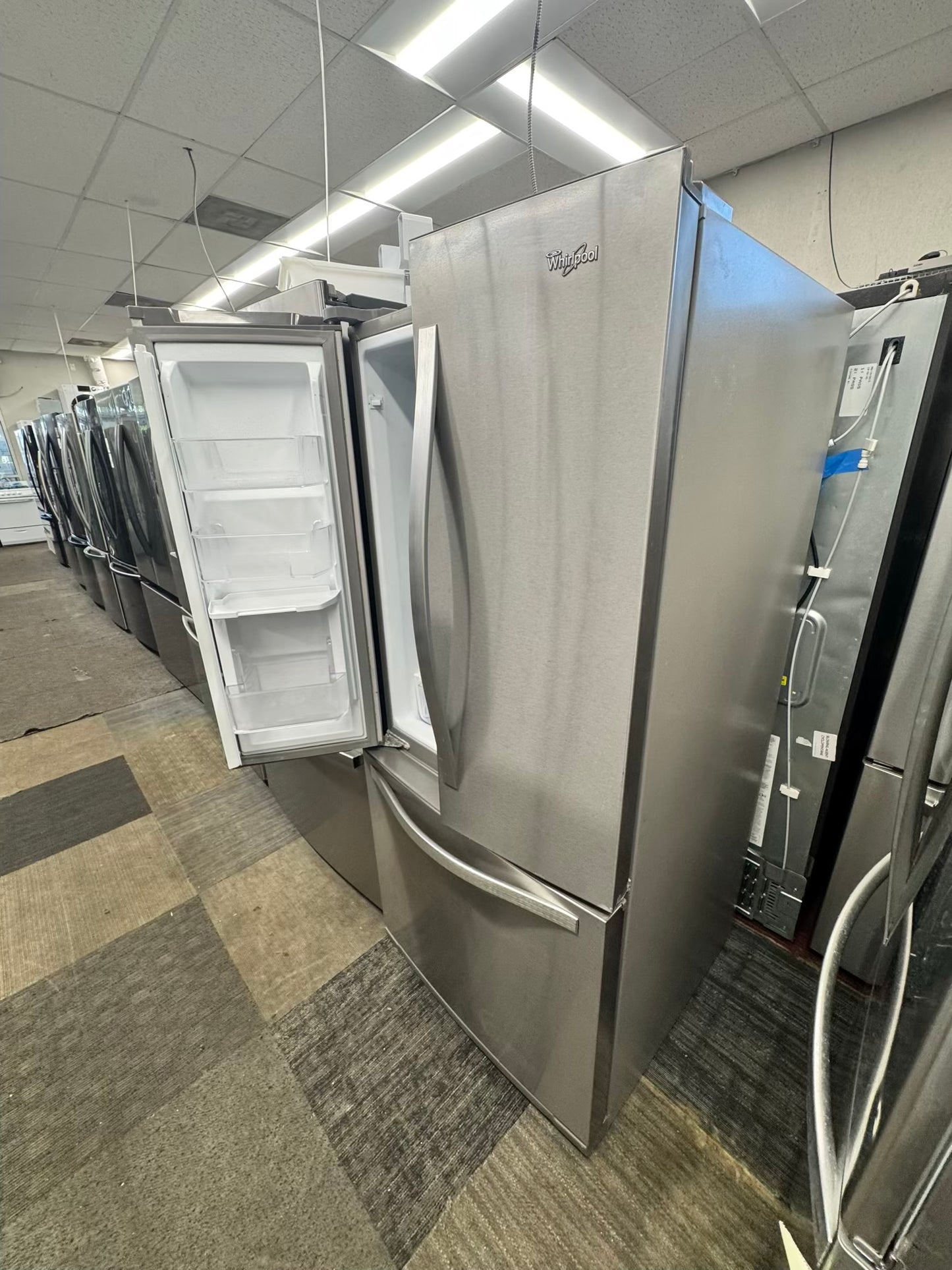 Whirpool 30 inch French door refrigerator stainless steel water dispenser and ice maker bottom