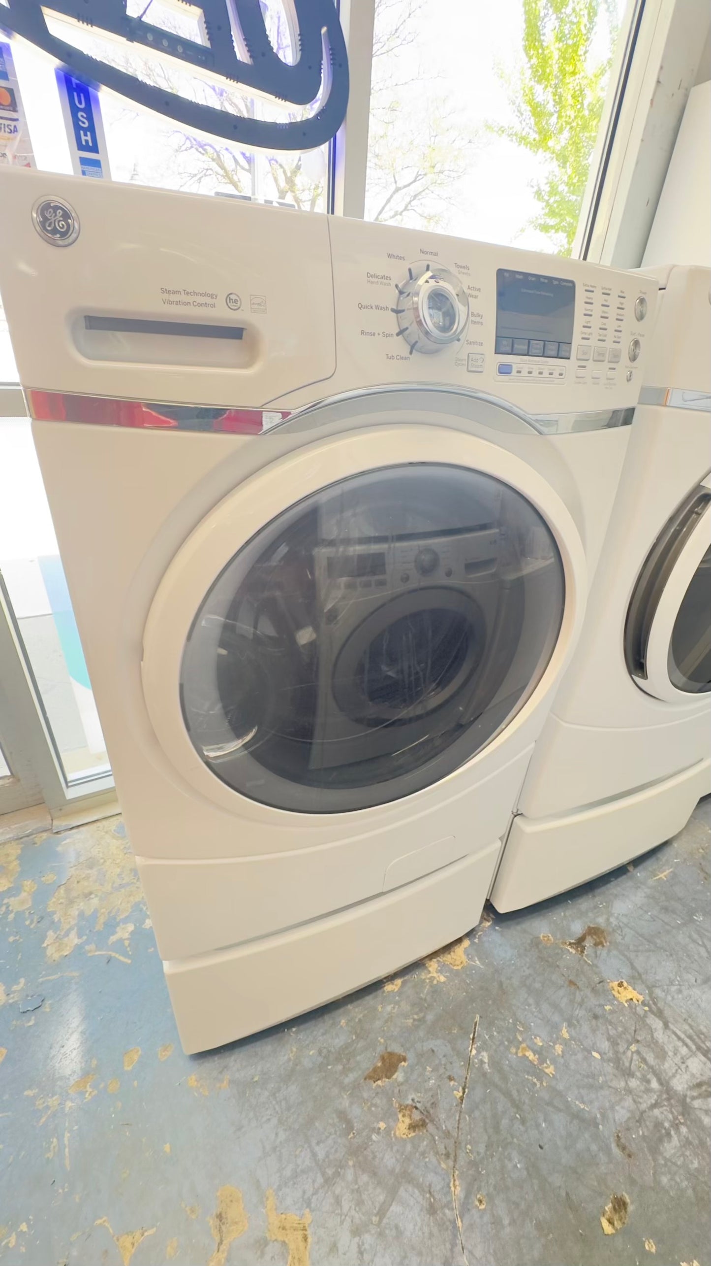^ GE washer & electric dryer set front load whit pedestal