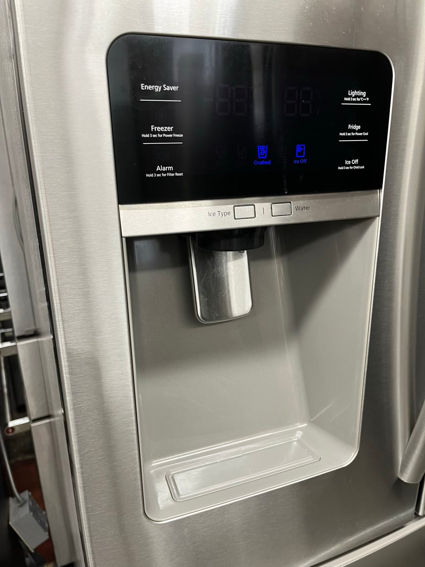 ^ Item #RF29R Samsung four door refrigerator stainless steel w/ ice and water dispenser inside 33’ in
