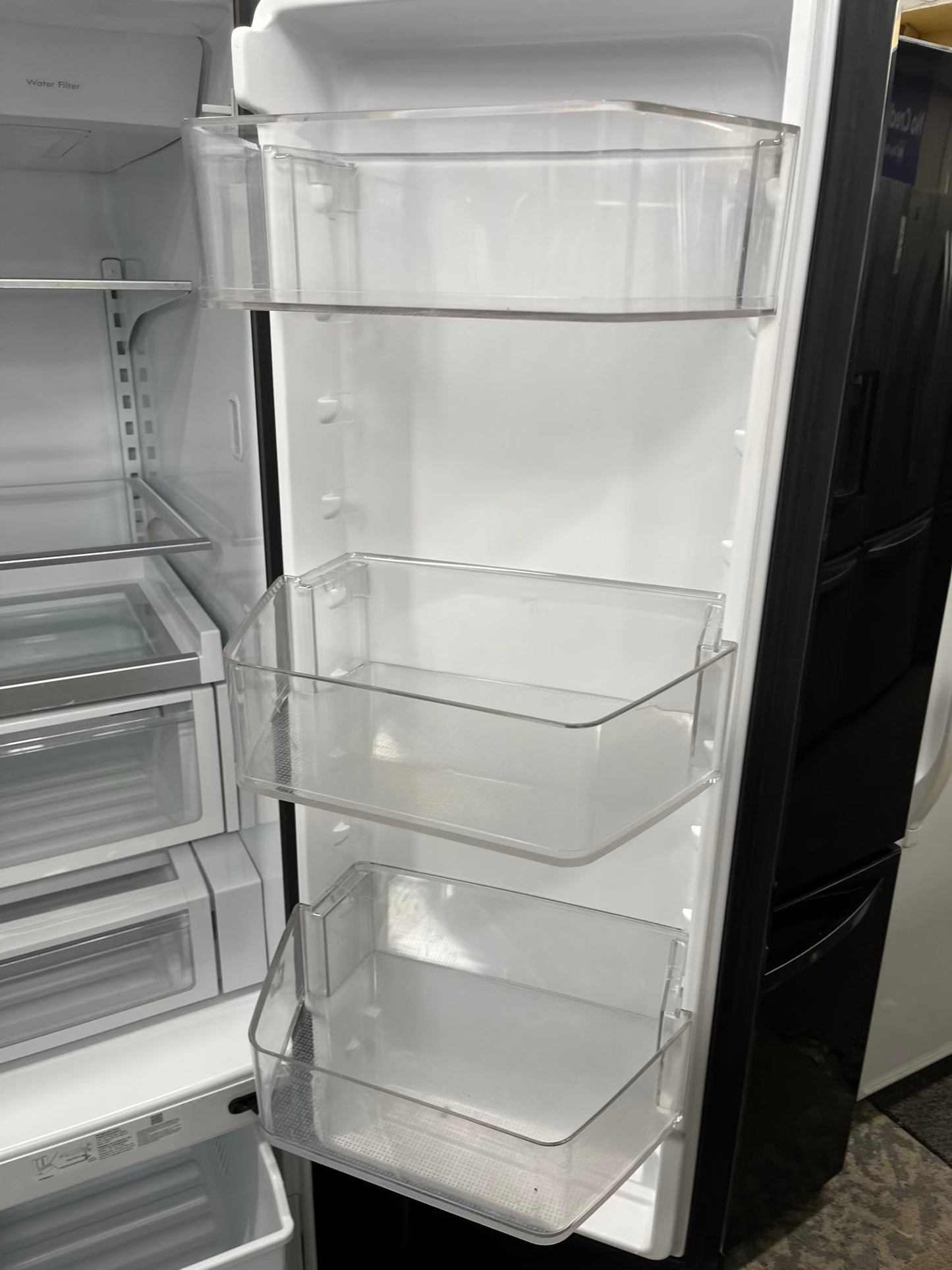 ^ Item: #RF74F Whirlpool french door refrigerator slate stainless steel w/ ice and water dispenser 36” in