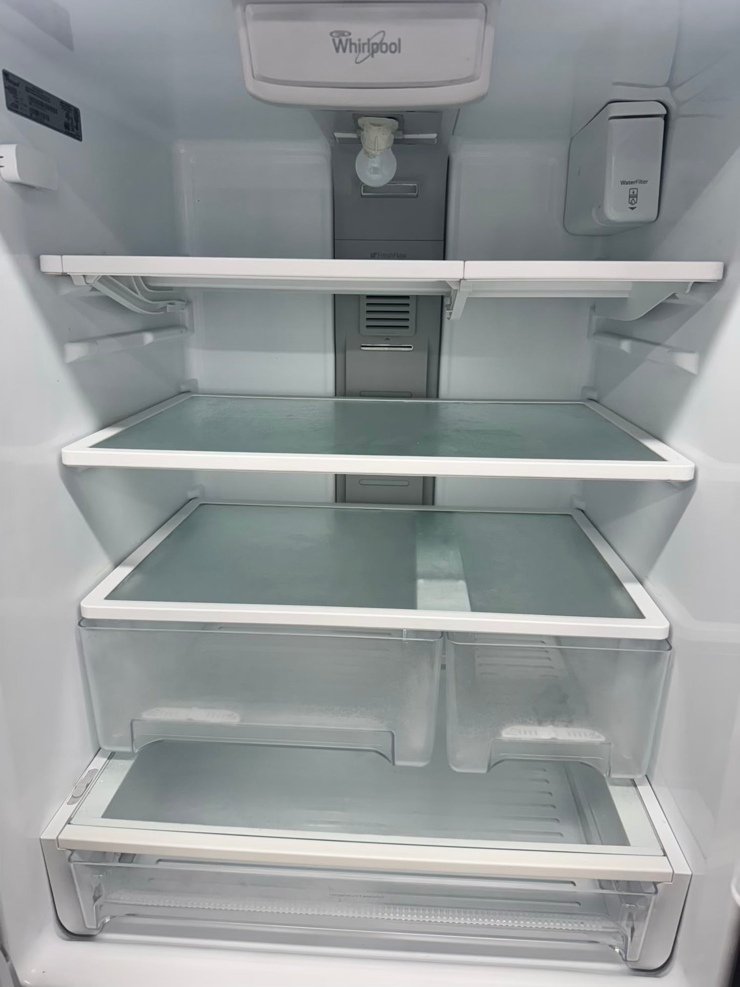 Whirpool 30 inch French door refrigerator stainless steel water dispenser and ice maker bottom