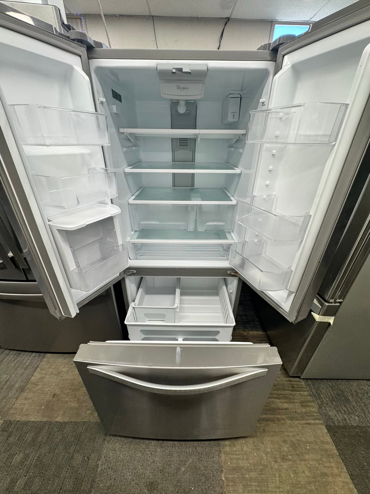 Whirpool 30 inch French door refrigerator stainless steel water dispenser and ice maker bottom