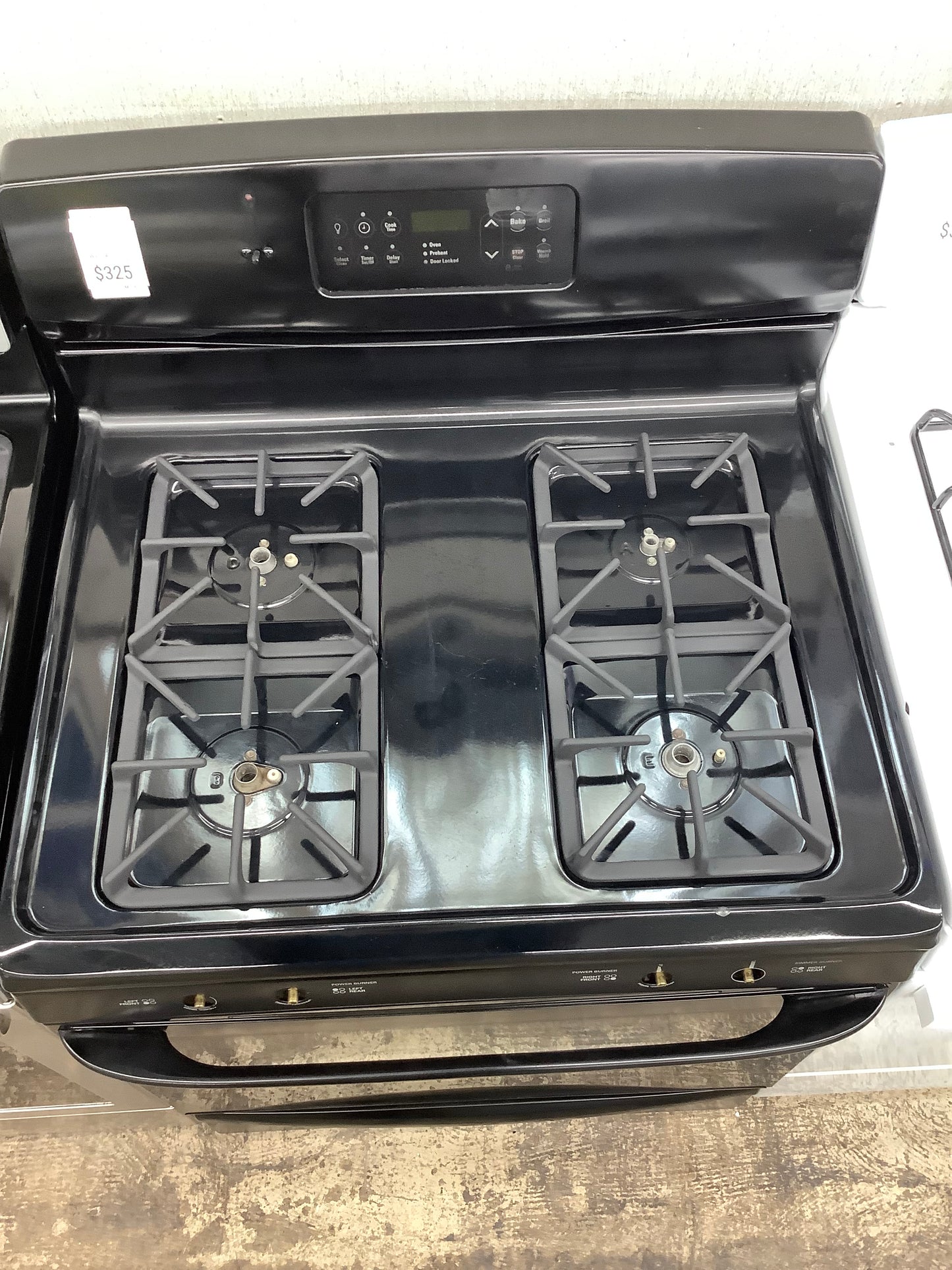 Kenmore gas range , 4 burner black color 30”
