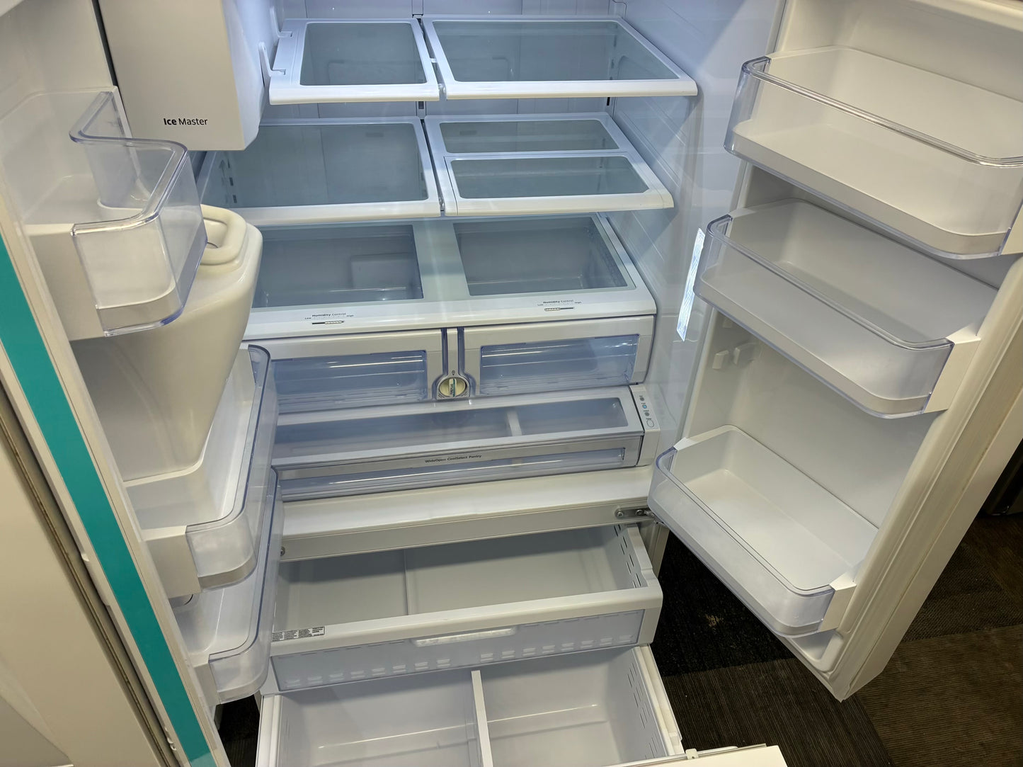 Samsung French door refrigerator white. w/ ice and water dispenser inside 36” in