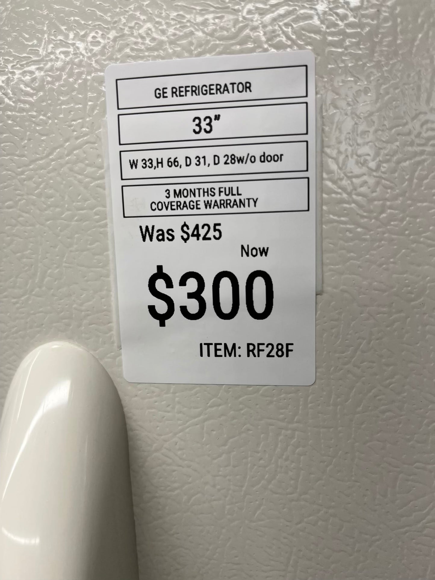 ^ ITEM: #RF28F GE top freezer bisque refrigerator 33” in