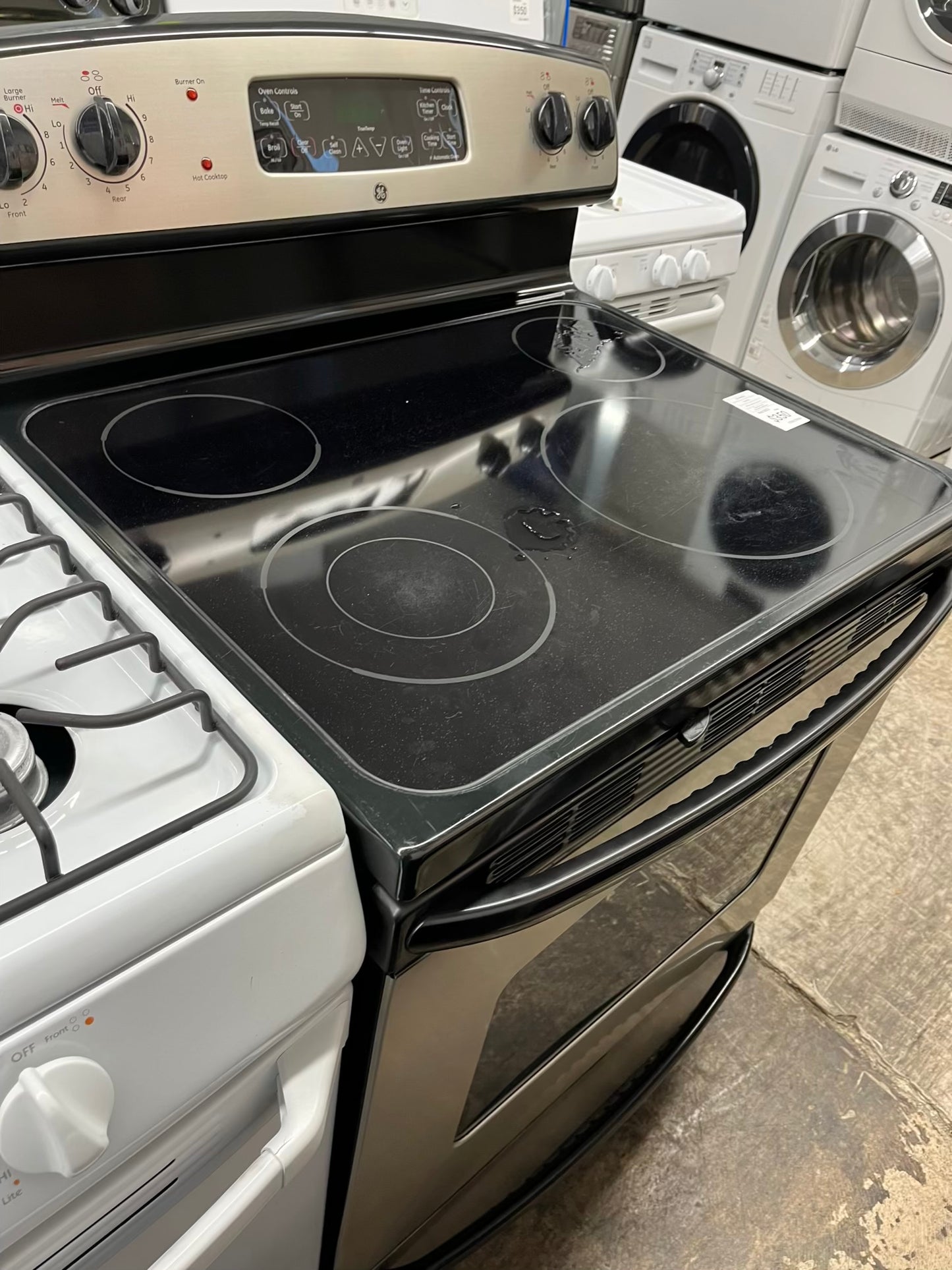 ^ Item : #ER93V GE electric range 4 burner stainless steel