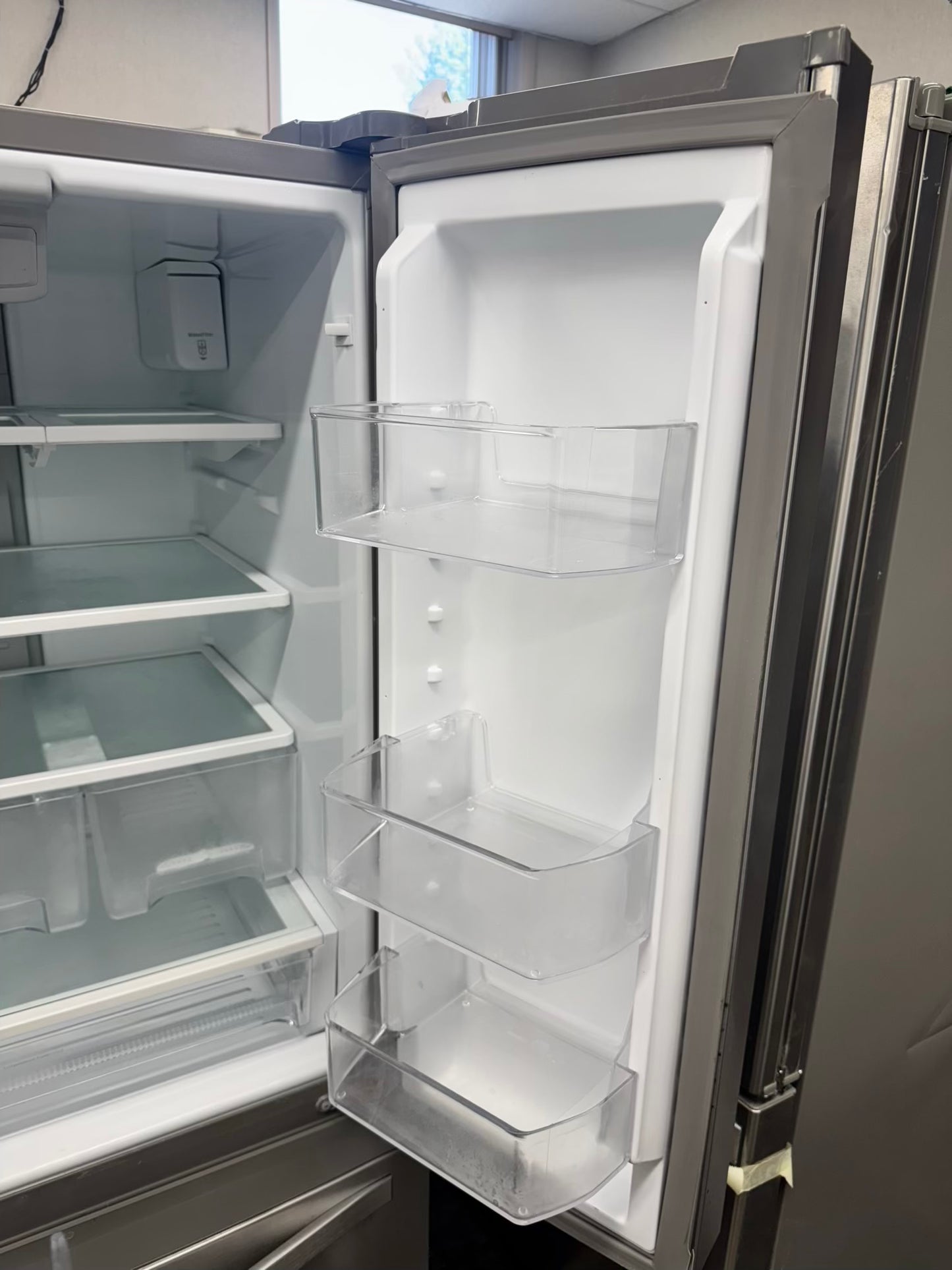 Whirpool 30 inch French door refrigerator stainless steel water dispenser and ice maker bottom