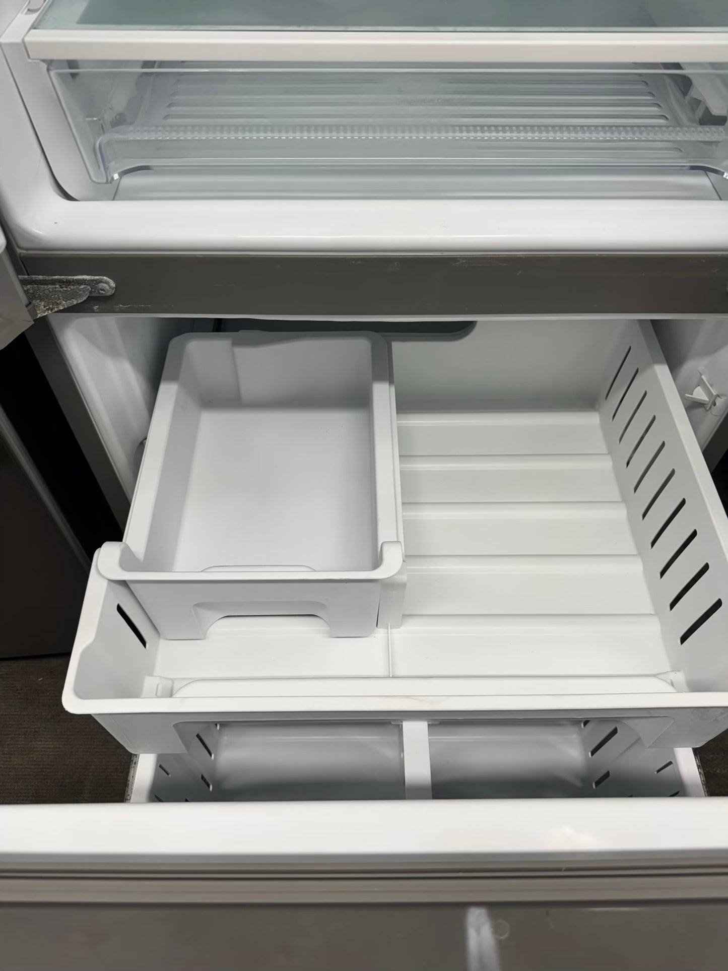 Whirpool 30 inch French door refrigerator stainless steel water dispenser and ice maker bottom