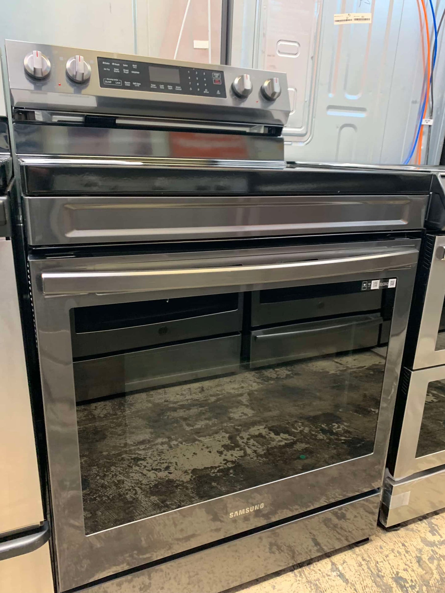 - ★ Samsung Open Box 6.3 cu. ft. Smart Wi-Fi Enabled Convection Electric Range with No Preheat AirFry in Black Stainless Steel - ER467