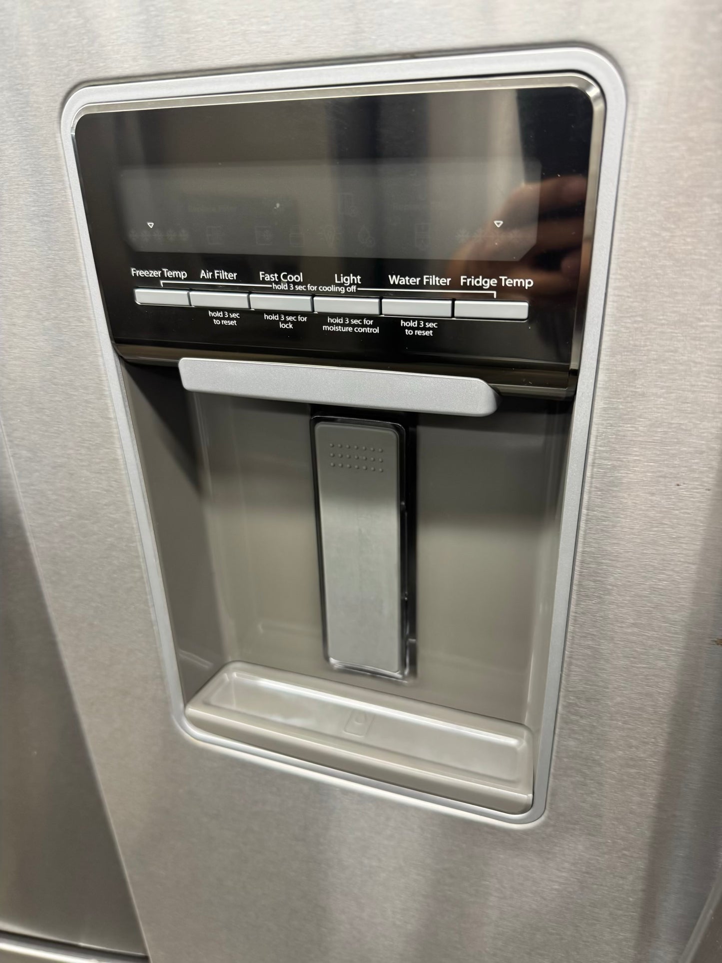 Whirpool 30 inch French door refrigerator stainless steel water dispenser and ice maker bottom