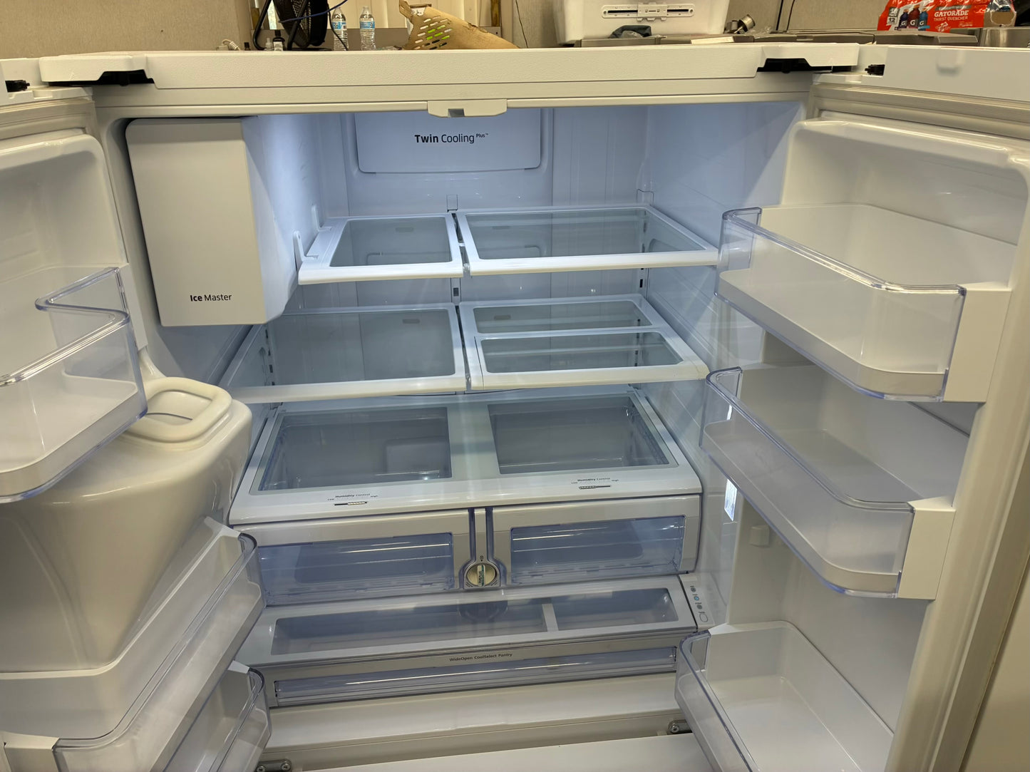Samsung French door refrigerator white. w/ ice and water dispenser inside 36” in