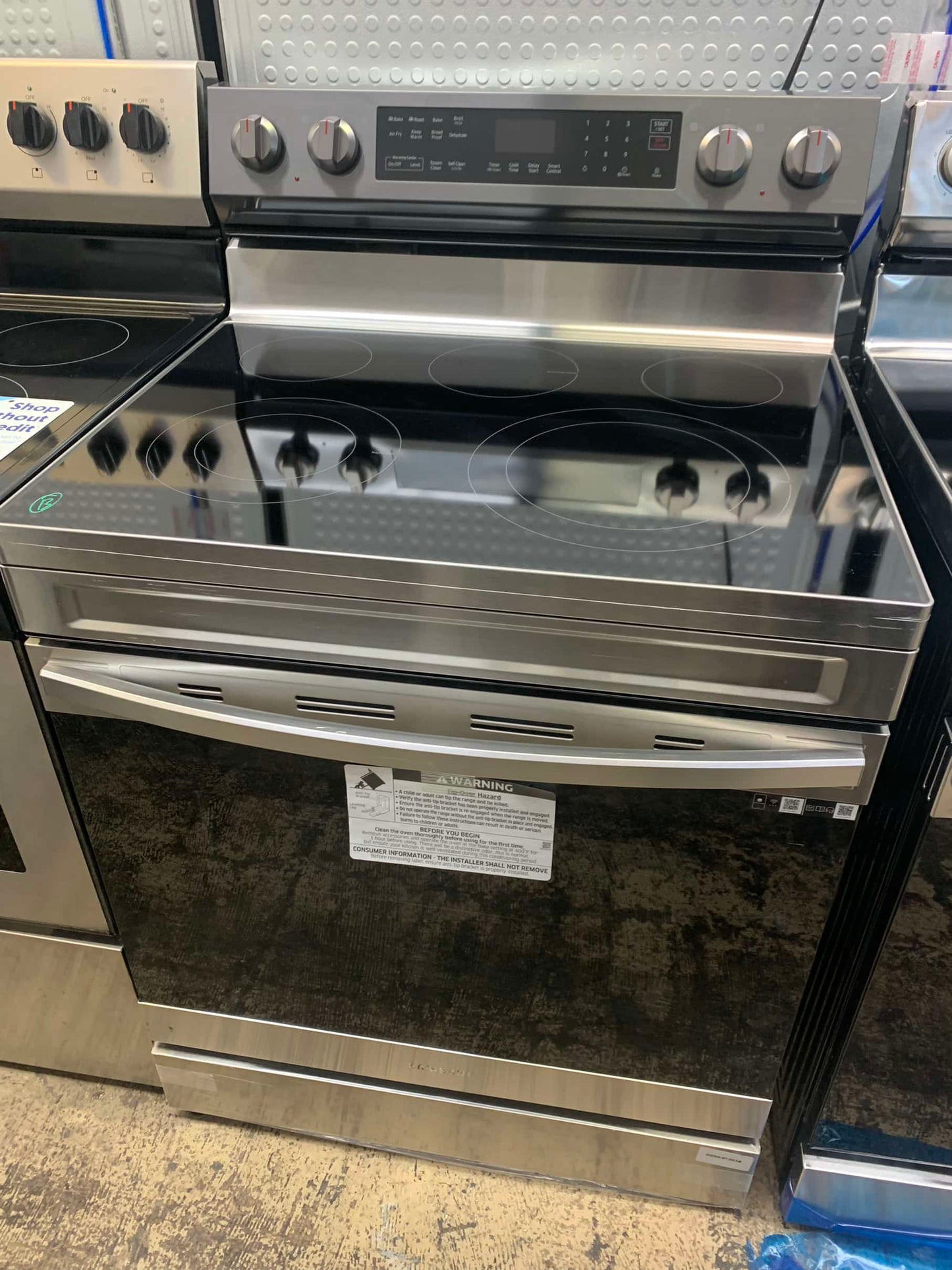 - ★ Samsung Open Box 6.3 cu. ft. Smart Wi-Fi Enabled Convection Electric Range with No Preheat AirFry in Black Stainless Steel - ER467
