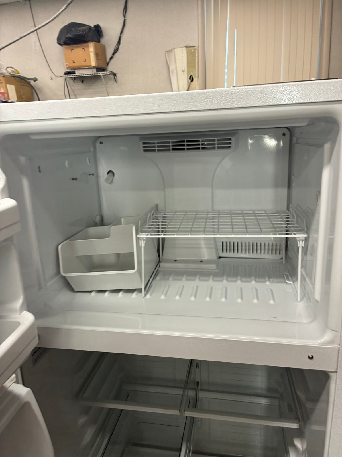 GE top freezer refrigerator  28”