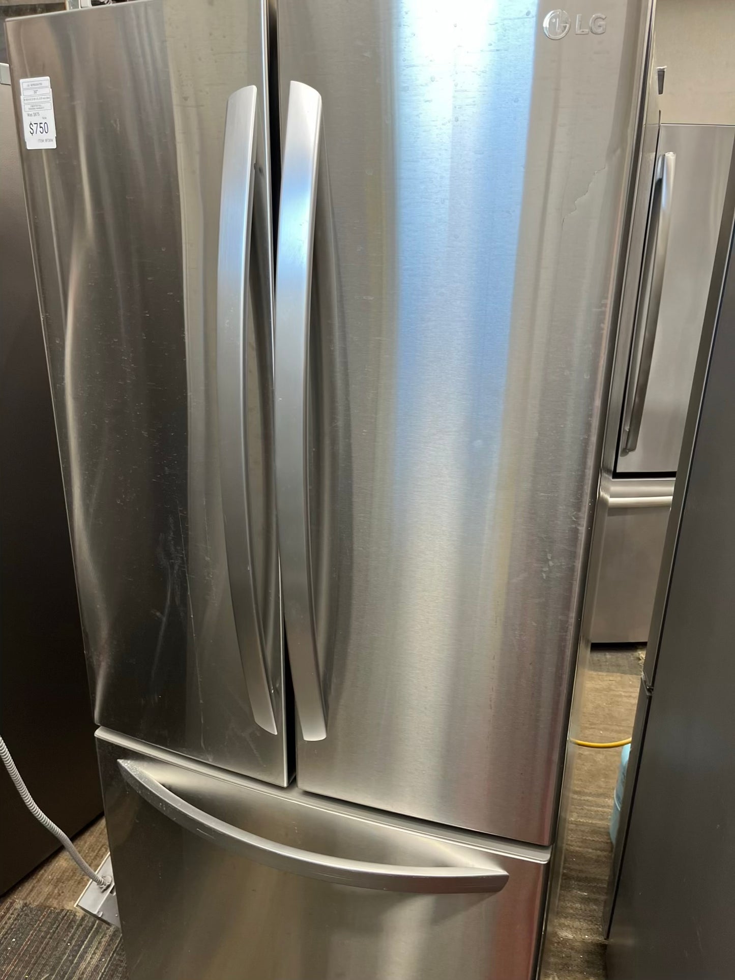 ^ Item #RF38W LG french door refrigerator stainless steel w/ ice  dispenser inside 30” in