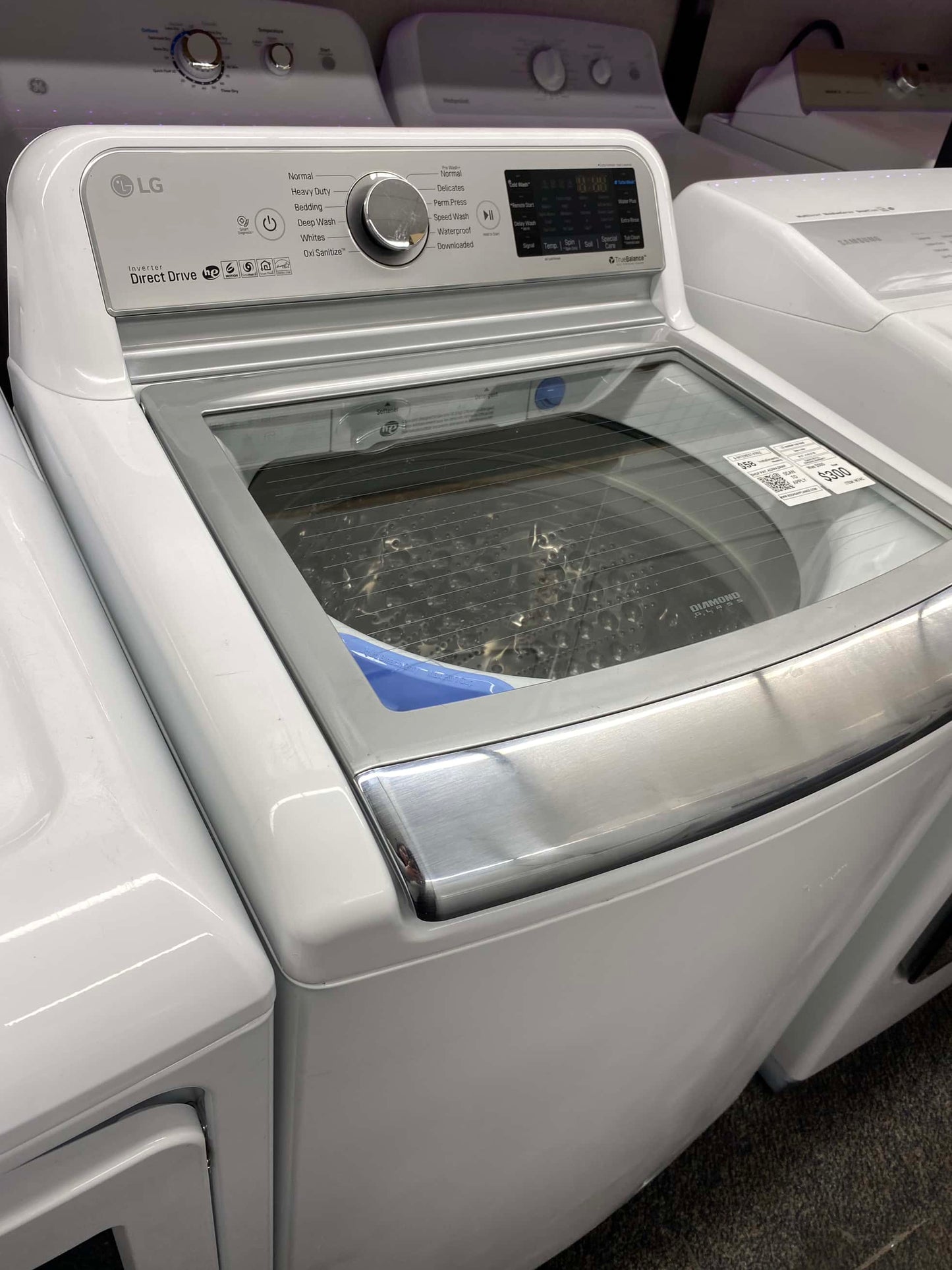 Item: #ED64B LG high efficiency and electric dryer andwqshing machine set stainless steel drum side by side 27”