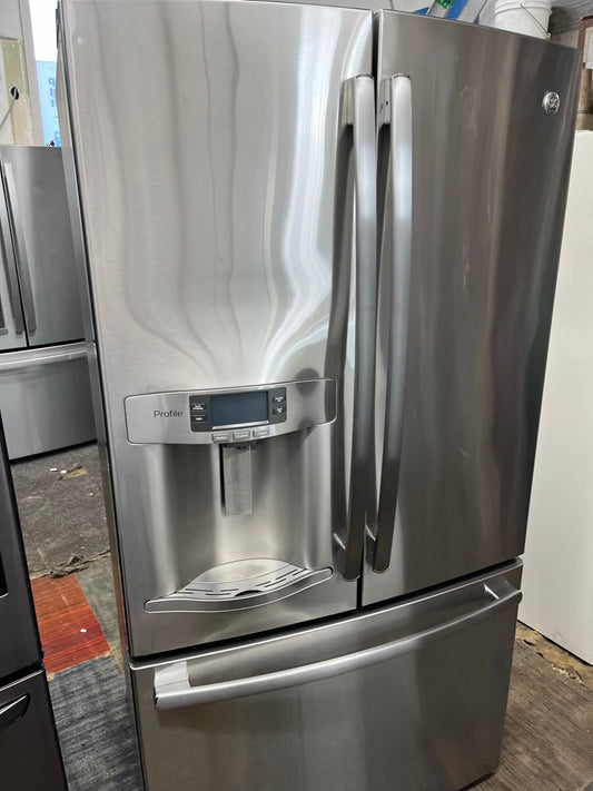 ^ Item #RF03Z GE counter depth  french door refrigerator slate stainless steel showcase w/ ice  dispenser inside 36” in