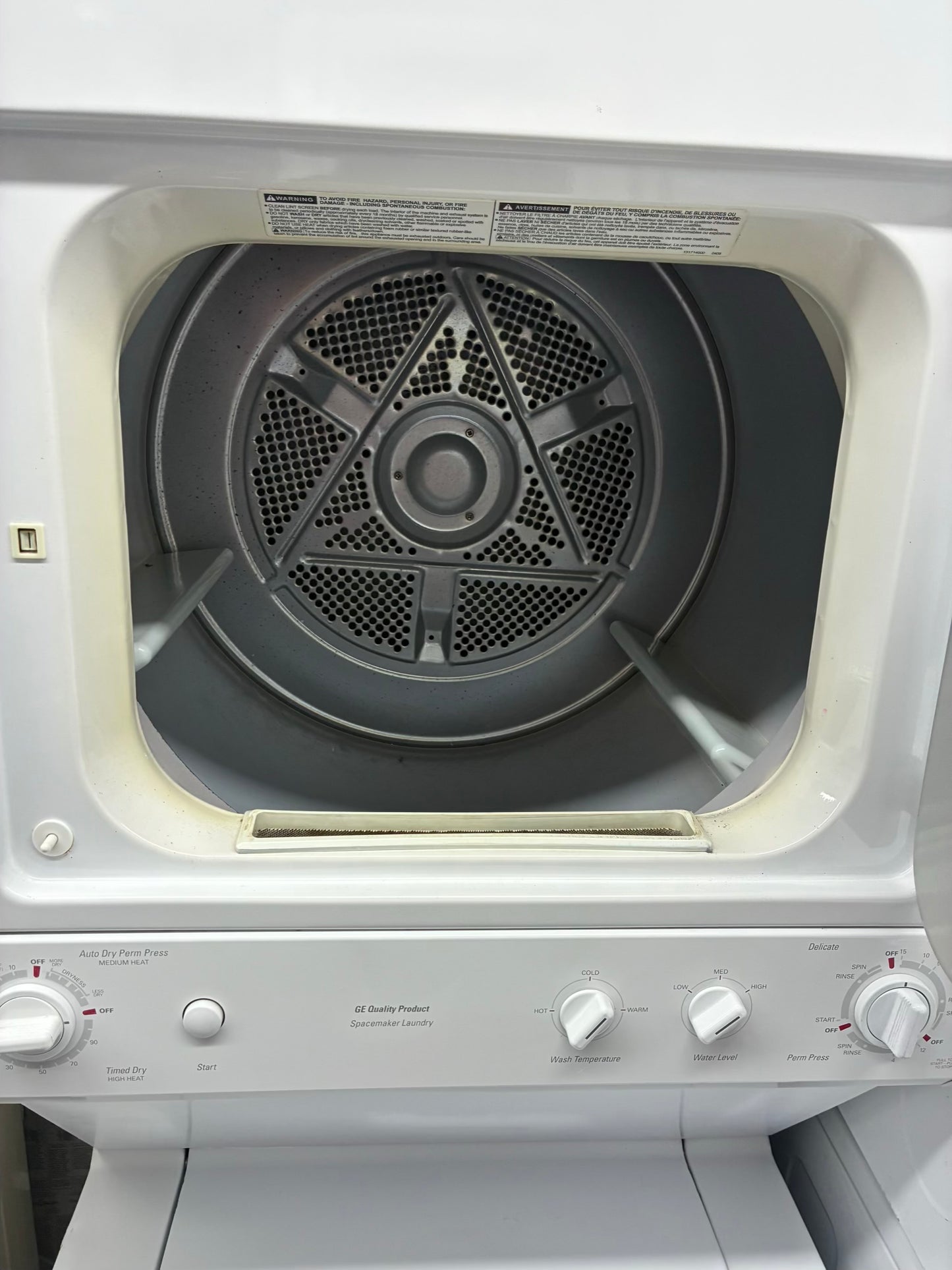 GE laundry center  washer and dryer set gas stackable 27”