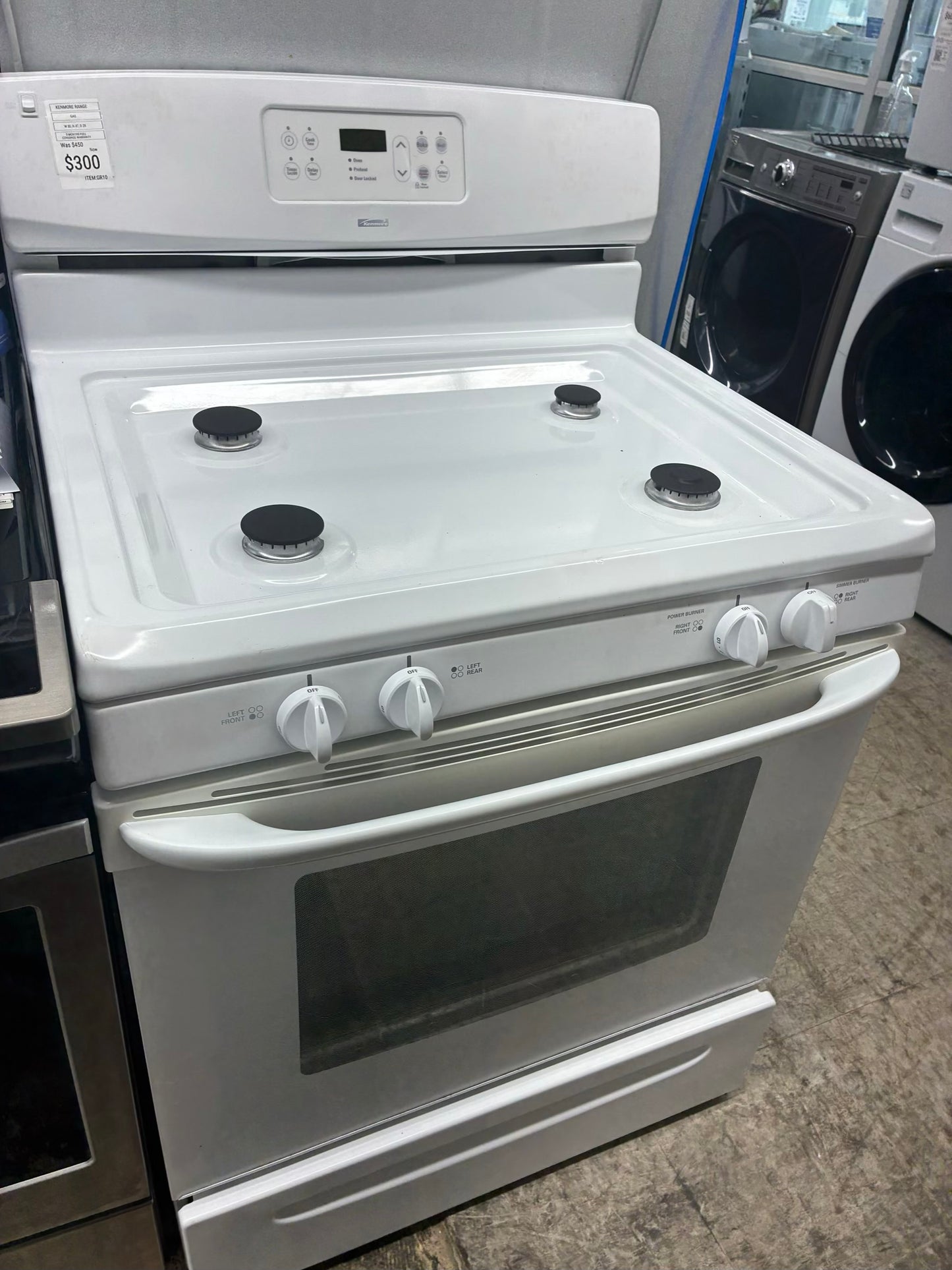 Kenmore gas range , 4 burner cream color 30”