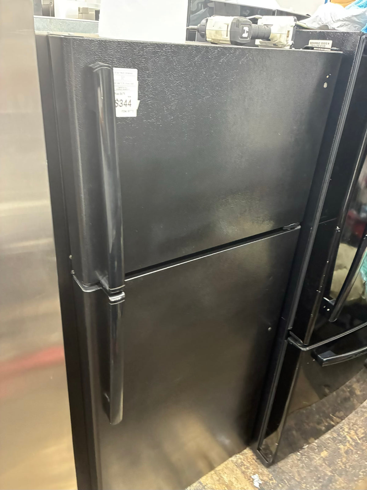 GE top freezer refrigerator  30” black