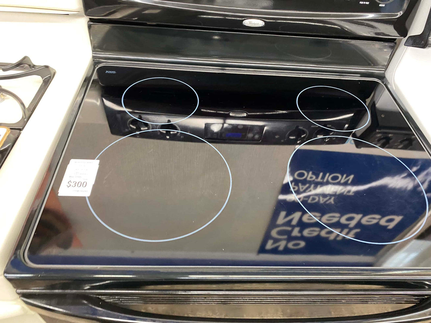 Item: #ER29U  whirlpool electric 220v range 4 burner  black  30 in