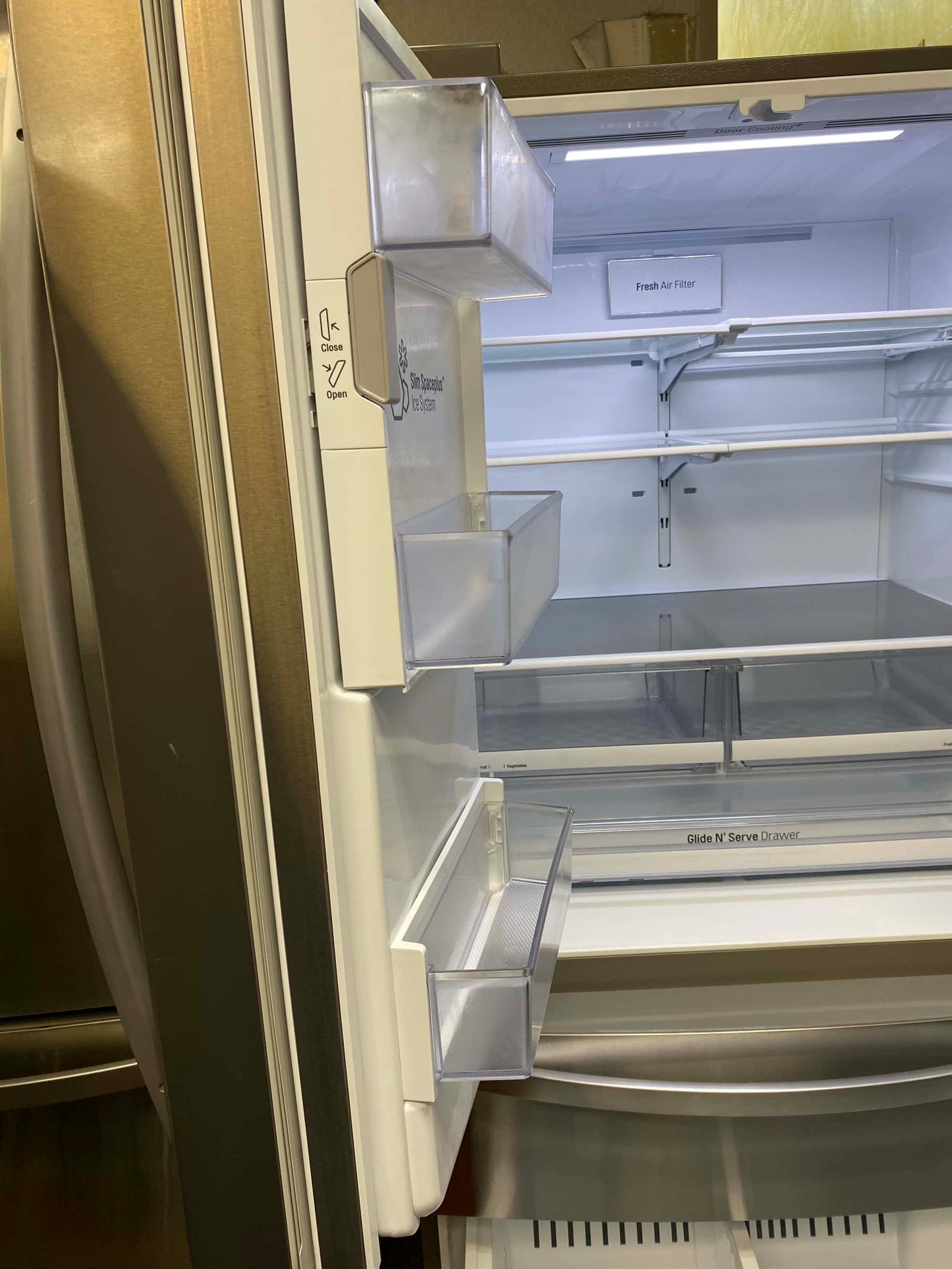 LG four door refrigerator stainless steel w/water ice dispenser 36 in
