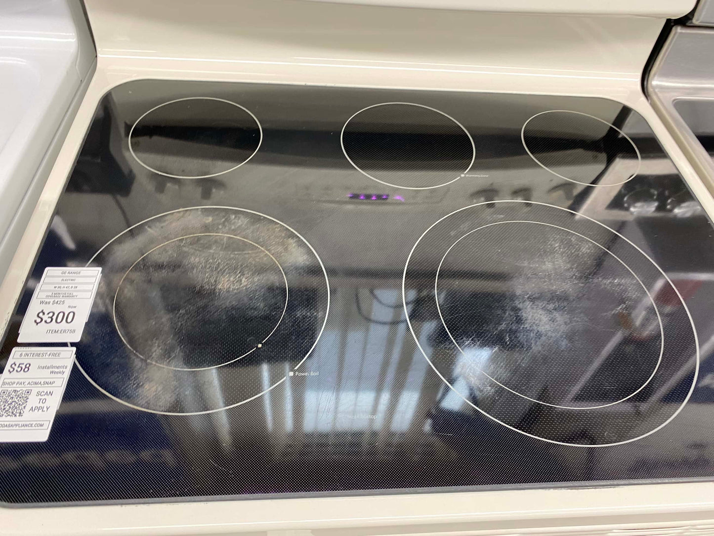 Item: #ER75B GE electric 220v range 4 burner  white 30 in