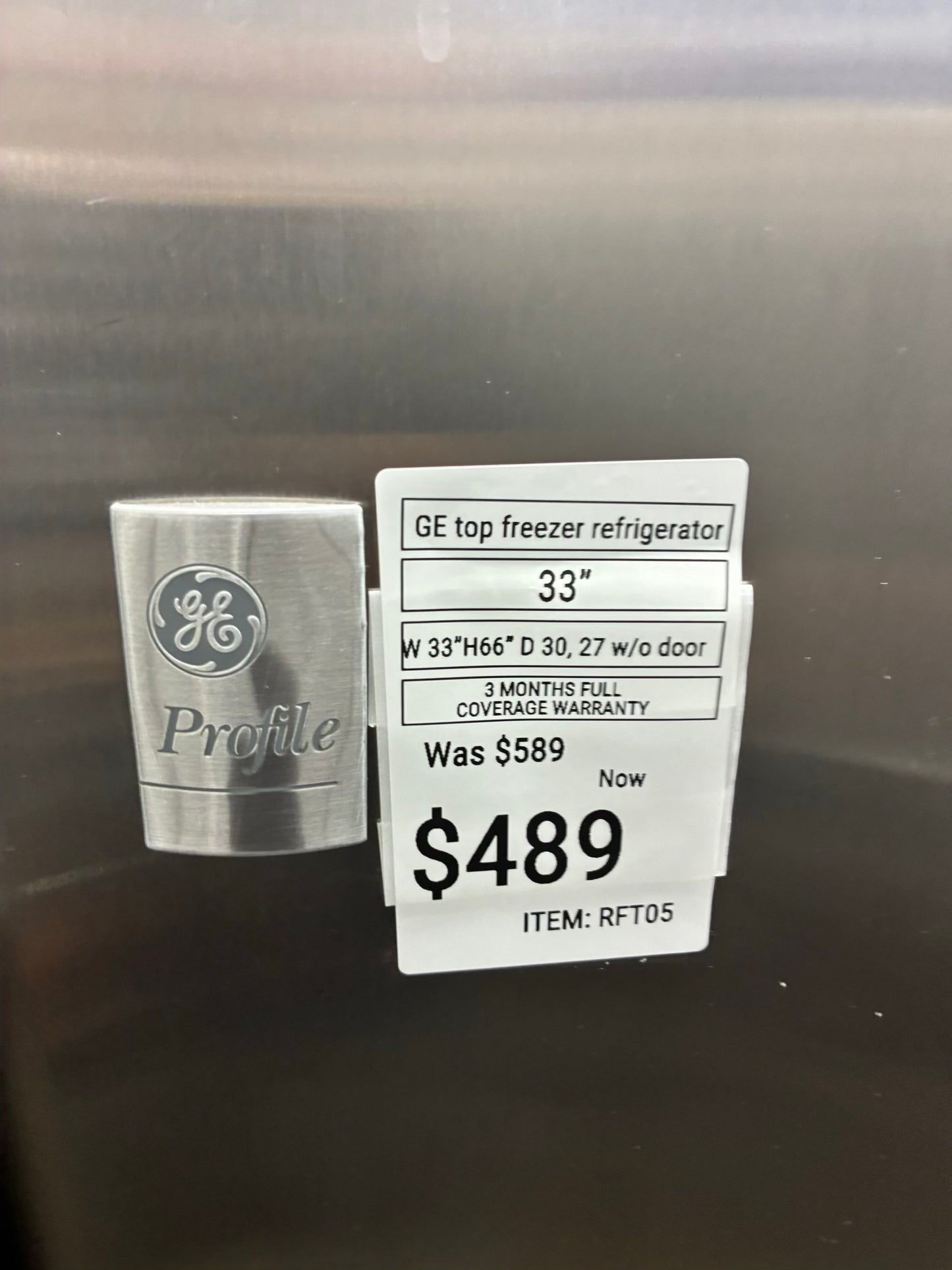 GE top freezer refrigerator stainless steel 33”