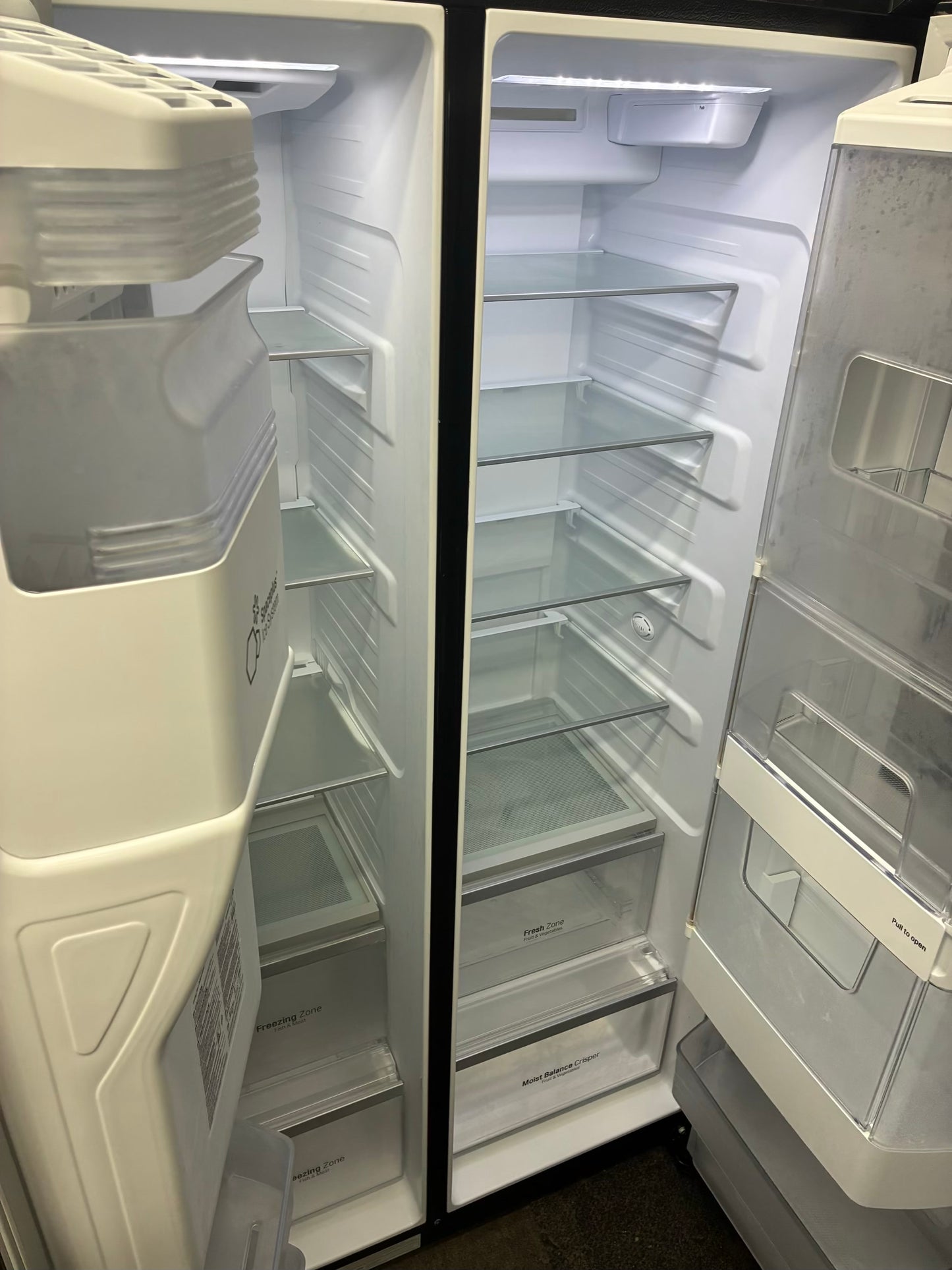 LG. Side by side smart refrigerator  with craft ice  maker water dispenser 36” in
