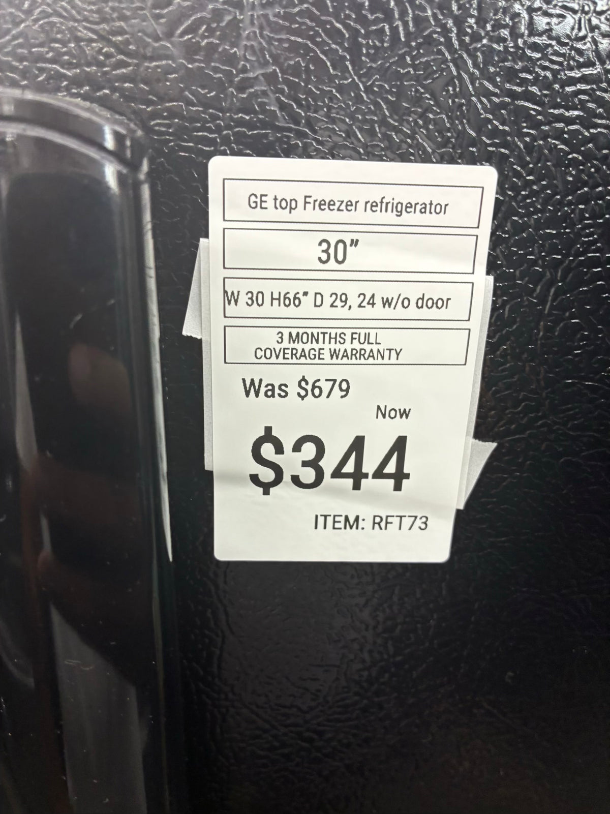 GE top freezer refrigerator  30” black