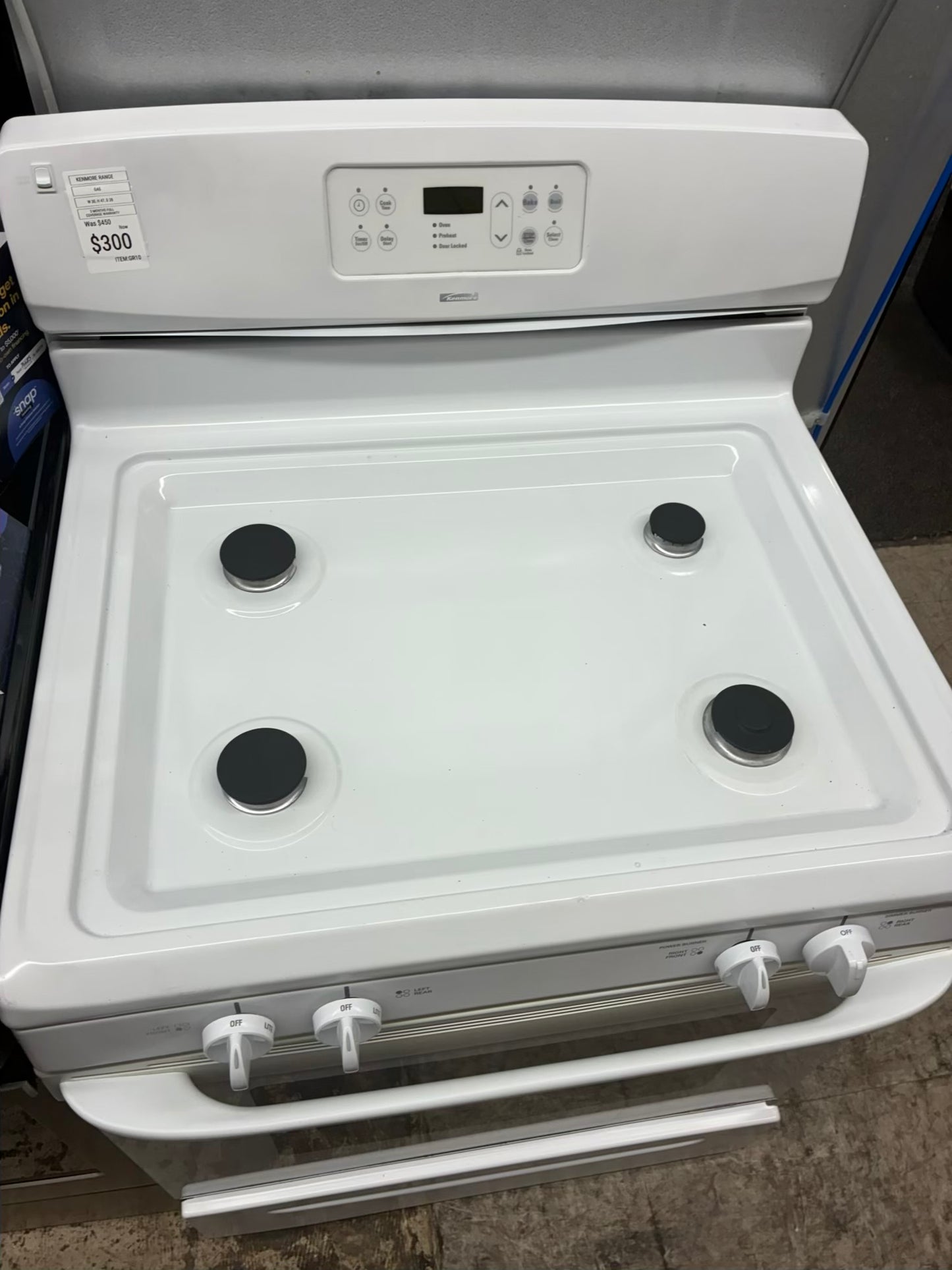 Kenmore gas range , 4 burner cream color 30”