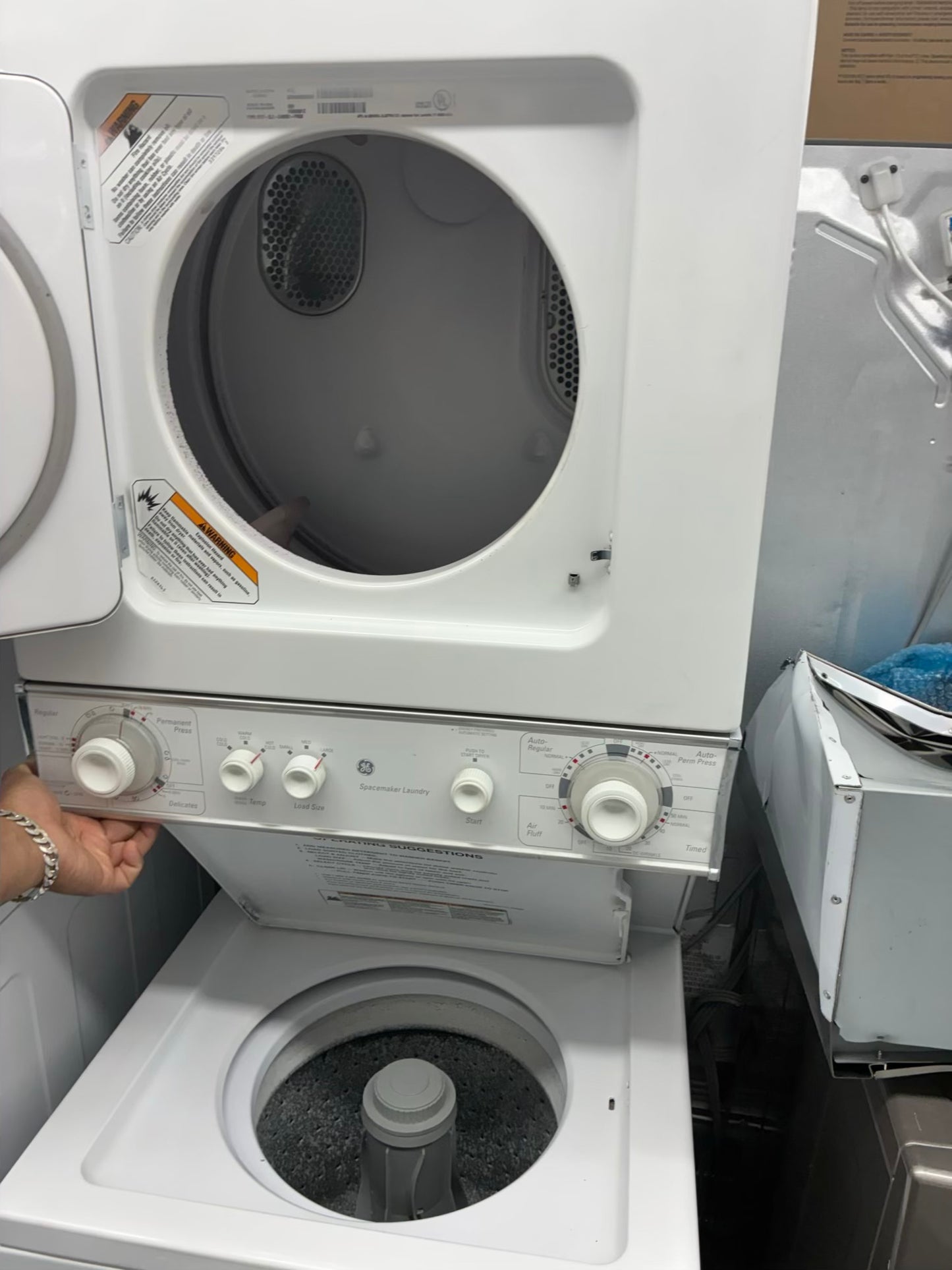 GE laundry center  washer and dryer set gas stackable 24”